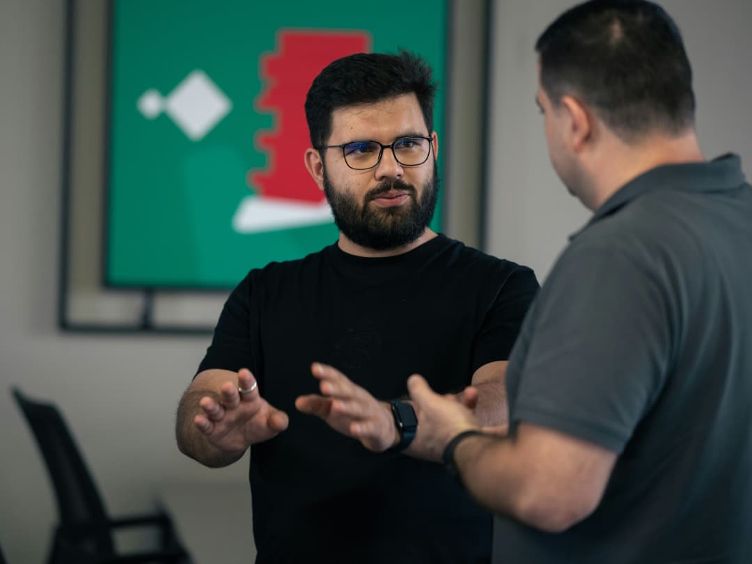 Two Canadian men talking about the recent Bank of Canada announcement and how it will impact their finances.
